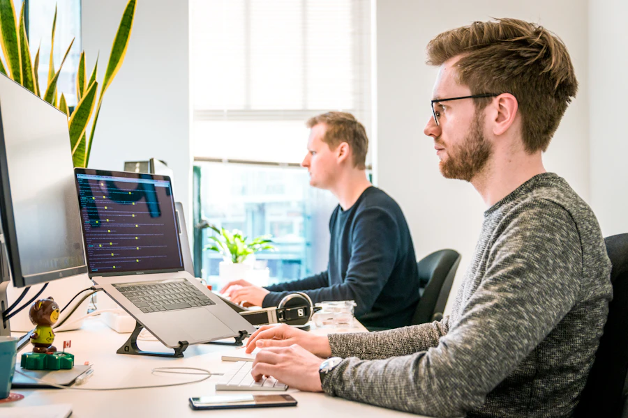 ReviveGuard client reviewing website uptime and backup dashboard on a laptop